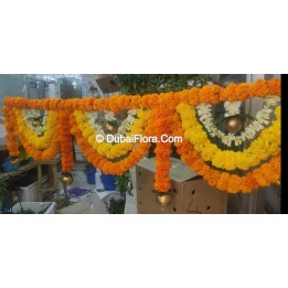 Flower Toran Of Fresh Marigold Yellow Orange And Tuberoses With Golden Ball