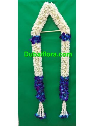 Graduation garland with fresh tube roses and blue orkit