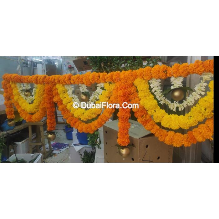 Flower Toran Of Fresh Mariegold Yellow Orange And Tuberoses With Golden Ball
