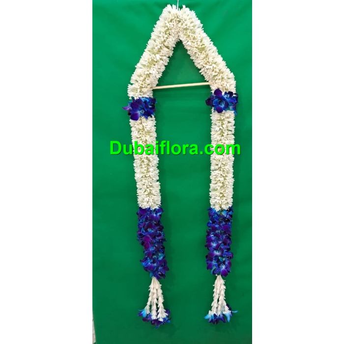 Graduation garland with fresh tube roses and blue orkit
