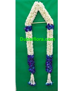 Graduation garland with fresh tube roses and blue orkit